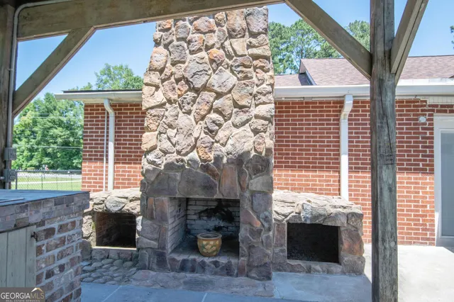 a backyard of a house with outdoor seating