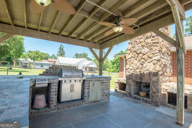 a view of a kitchen with a sink and wooden floors