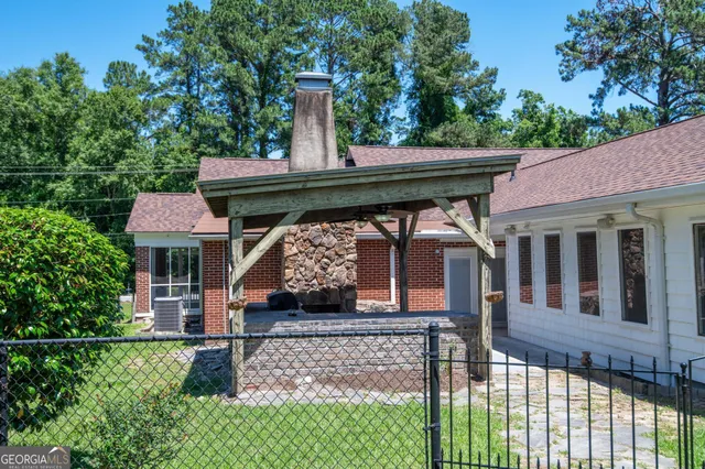 a front view of a house with a garden and deck