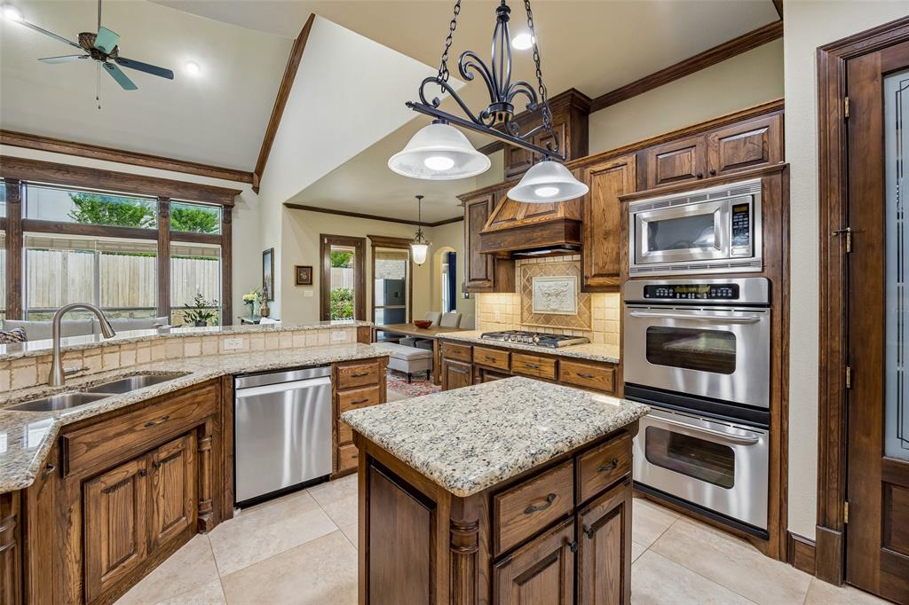 1608 Tuscan Ridge Circle Southlake, TX 76092 - Photo 12 of 36 a kitchen with a stove and a microwave