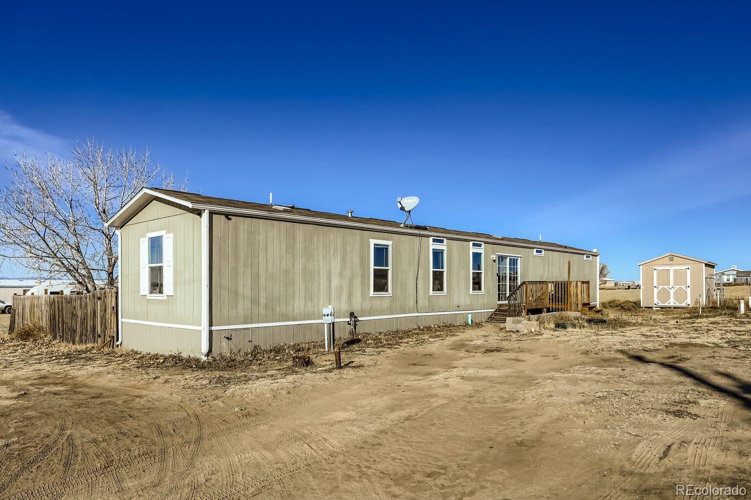 27604 Mucho Grande View Road Calhan, CO 80808 - Photo 1 of 16 a view of a house with backyard