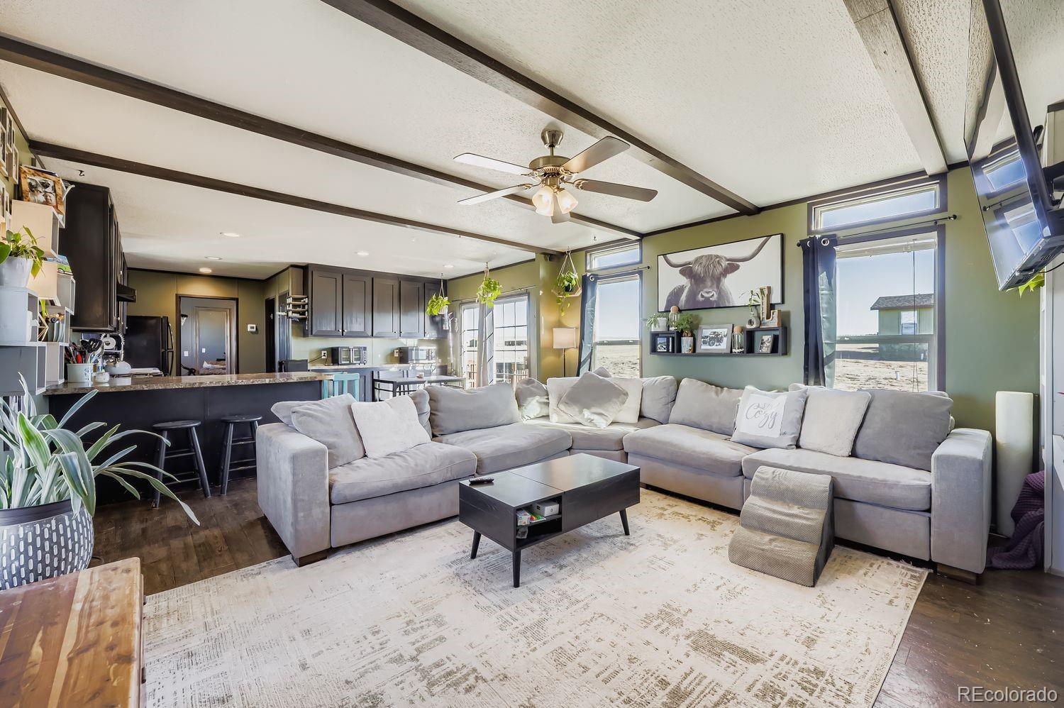 27604 Mucho Grande View Road Calhan, CO 80808 - Photo 5 of 16 a living room with furniture and a large window
