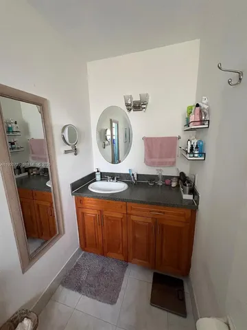 a kitchen with stainless steel appliances granite countertop a sink and a stove