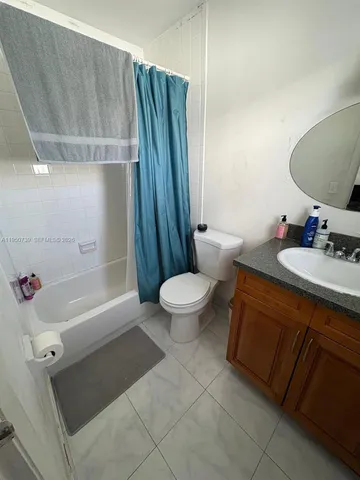 a bathroom with a sink a toilet and a bathtub