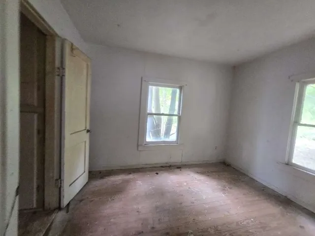 a view of house with backyard