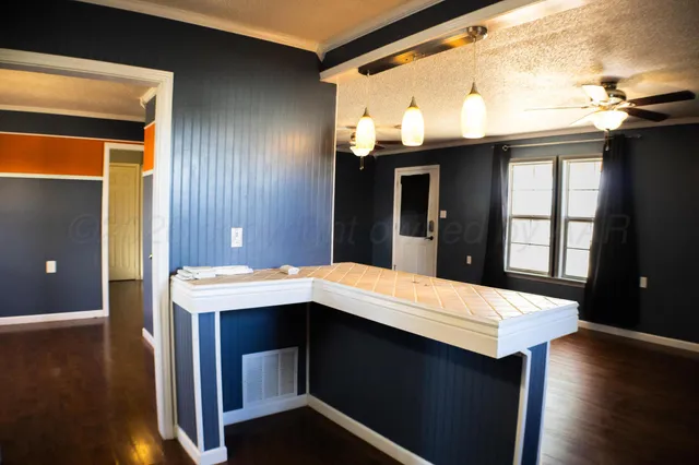 a room with a table and chairs