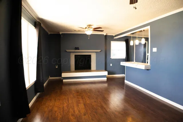 a view of a livingroom with a kitchen