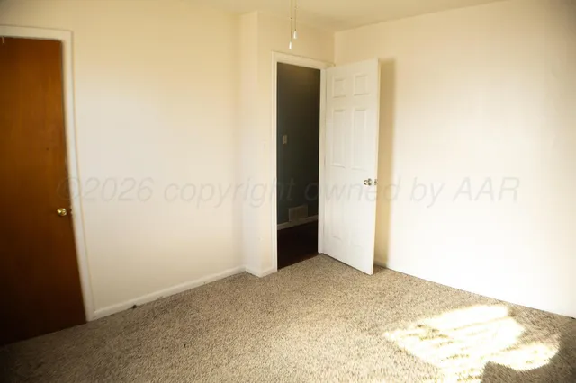 a view of an empty room and window