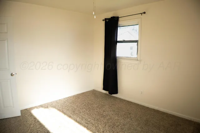 a view of a big room with yellow walls