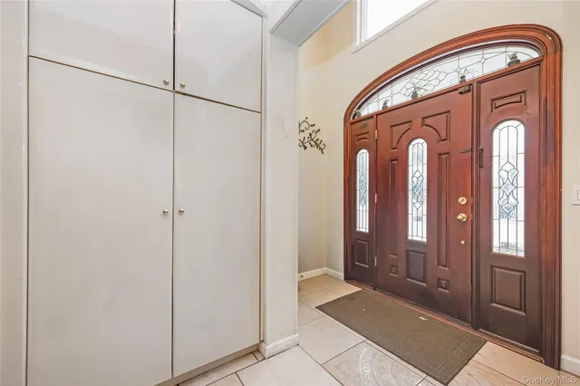 a bathroom with a sink a mirror toilet and bathtub