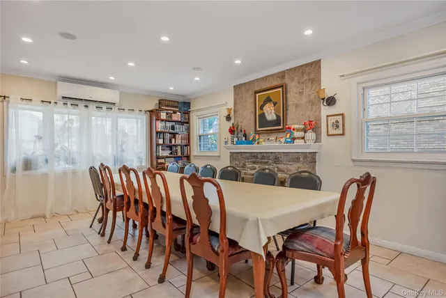 a kitchen with stainless steel appliances lots of white furniture a sink a counter top space and cabinets