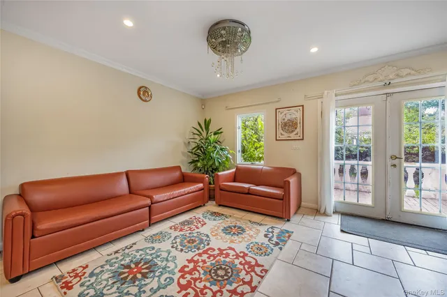 a kitchen with granite countertop white cabinets and appliances