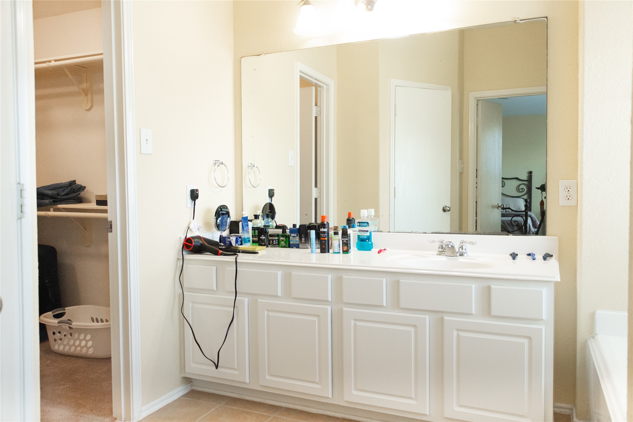20403 Shire Ridge Lane Humble, TX 77338 - Photo 18 of 30 a bathroom with a sink and a mirror