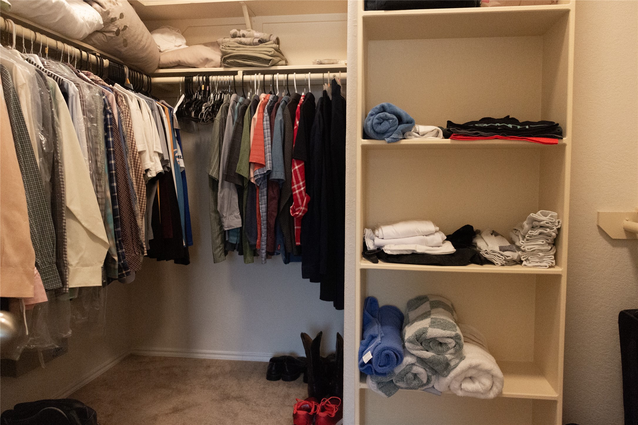 20403 Shire Ridge Lane Humble, TX 77338 - Photo 21 of 30 a view of walk in closet with clothes and shoes