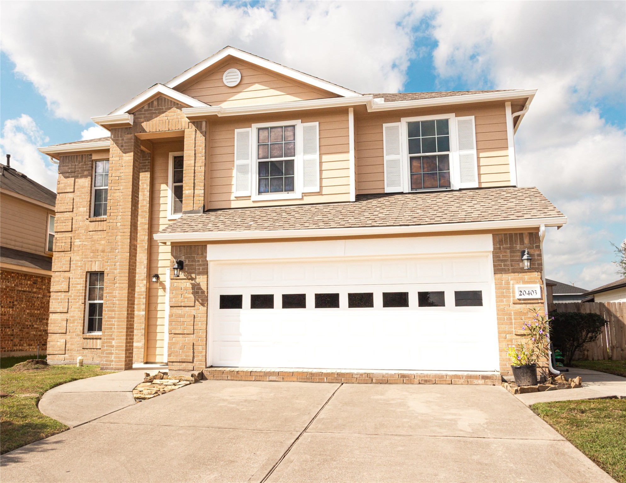 20403 Shire Ridge Lane Humble, TX 77338 - Photo 30 of 30 a view of a brick house with large windows