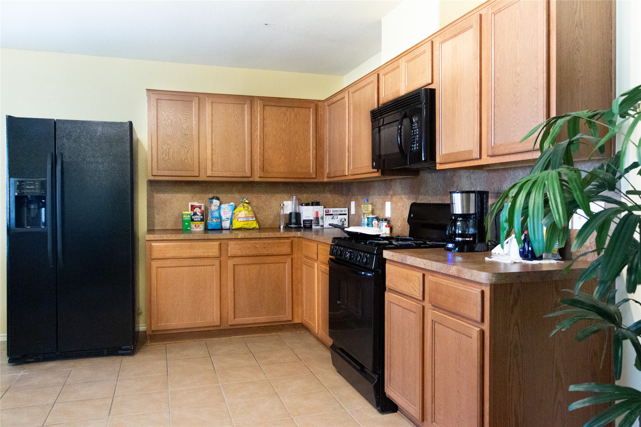20403 Shire Ridge Lane Humble, TX 77338 - Photo 9 of 30 a kitchen with stainless steel appliances granite countertop a refrigerator sink and microwave