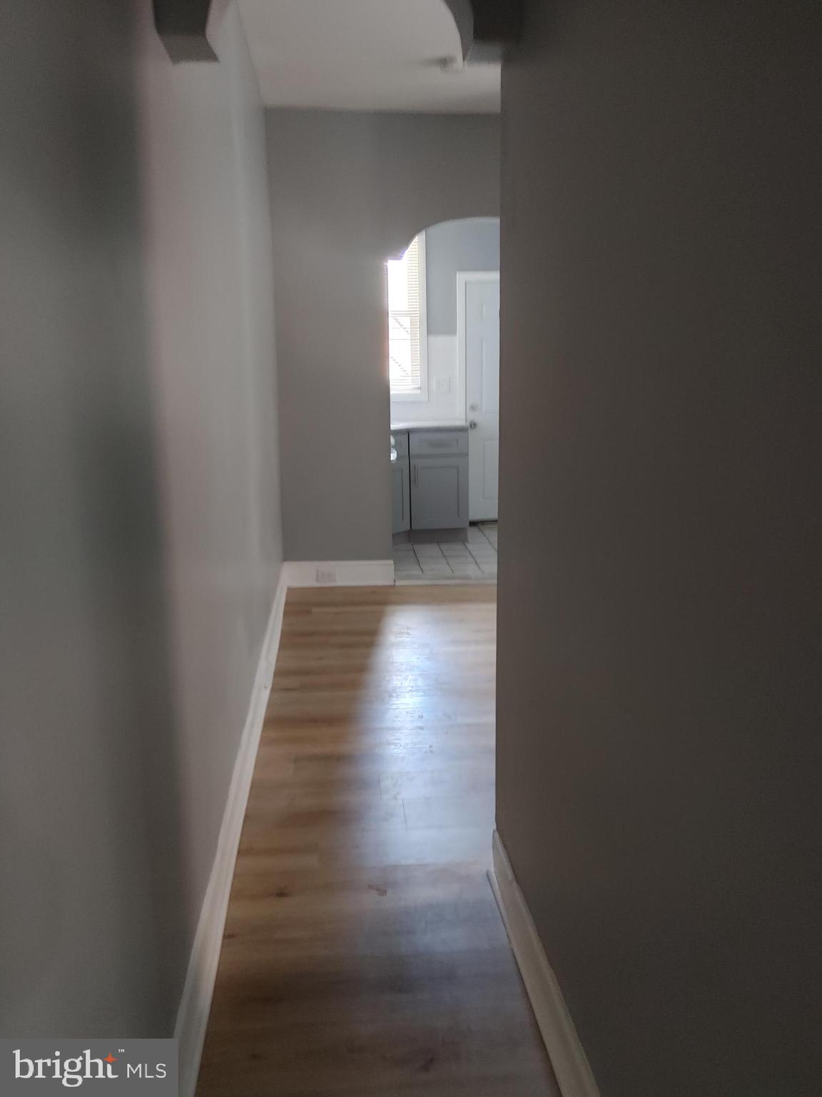 5917 Spruce Street, Unit 1 Philadelphia, PA 19139 - Photo 8 of 15 a view of wooden floor and windows in a room