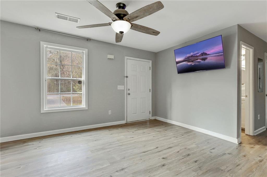 54 Taylorsville Road Aragon, GA 30104 - Photo 16 of 29 wooden floor in an empty room with a window