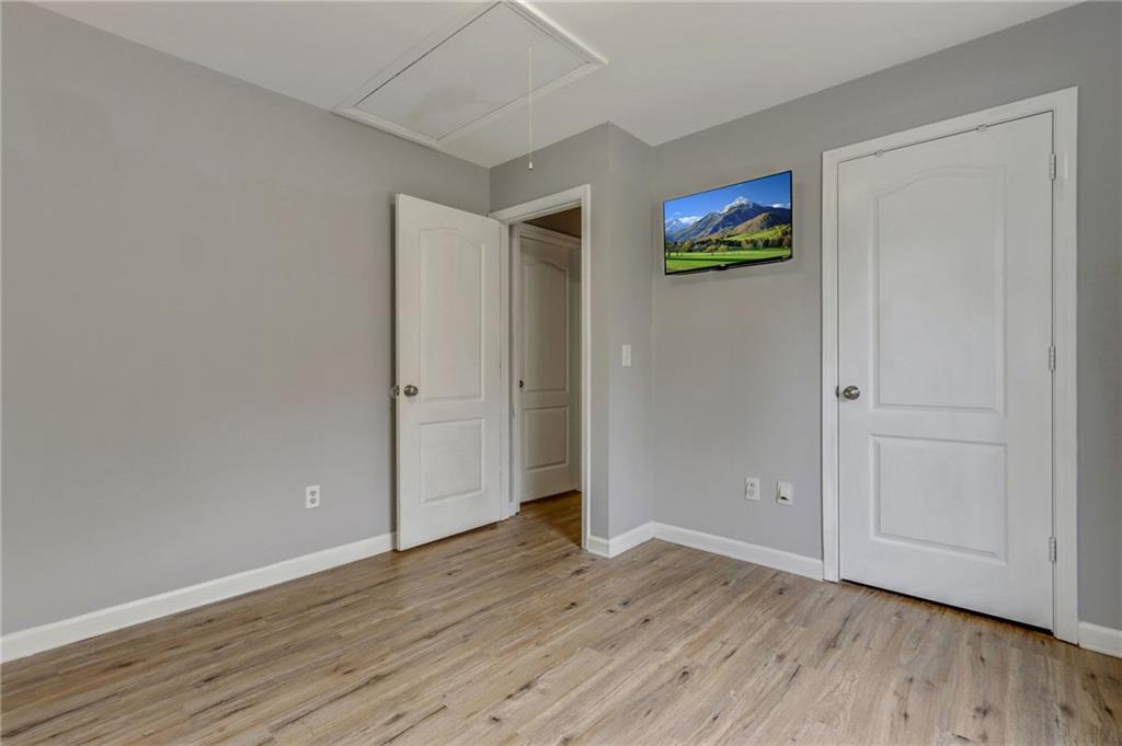 54 Taylorsville Road Aragon, GA 30104 - Photo 22 of 29 a view of an empty room with wooden floor