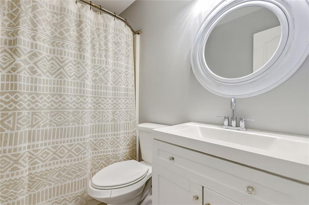 54 Taylorsville Road Aragon, GA 30104 - Photo 6 of 29 a bathroom with a sink a toilet and a mirror