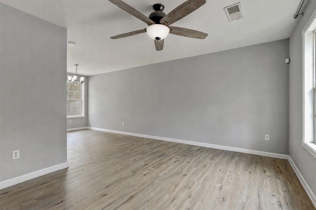 54 Taylorsville Road Aragon, GA 30104 - Photo 8 of 29 wooden floor in an empty room with a window
