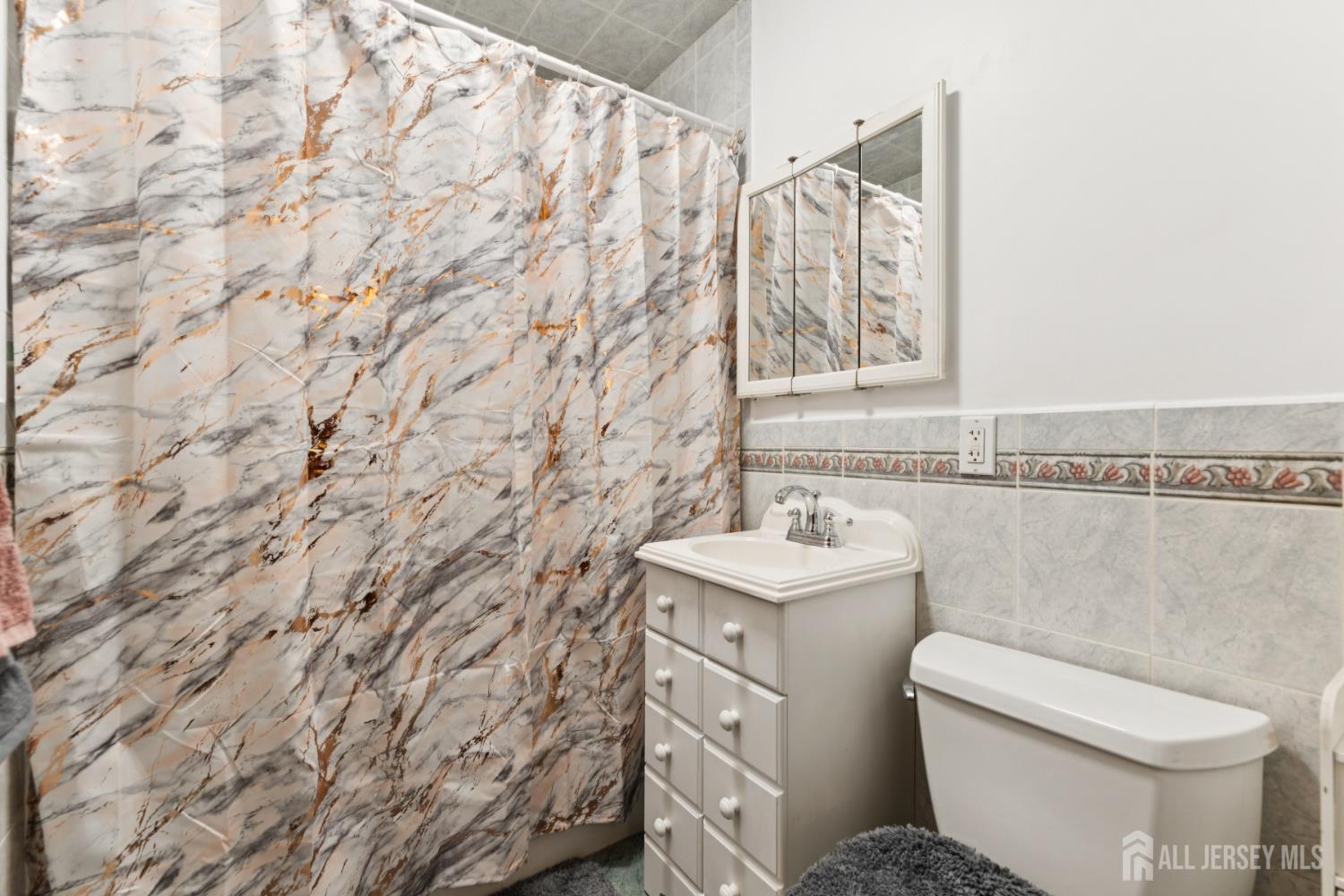 19 Overlook Terrace Fords, NJ 08863 - Photo 10 of 18 a bathroom with a sink and a toilet