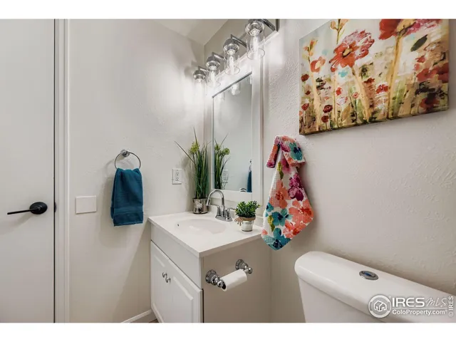 a bathroom with a sink mirror and vanity