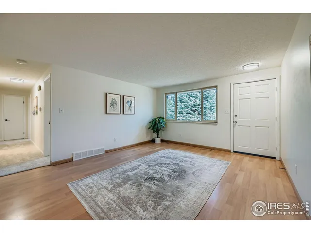 a view of an empty room and window