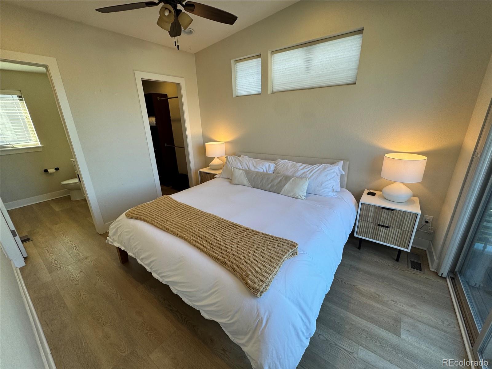 2124 Decatur Street Denver, CO 80211 - Photo 11 of 29 a bedroom with a bed and a walk in closet