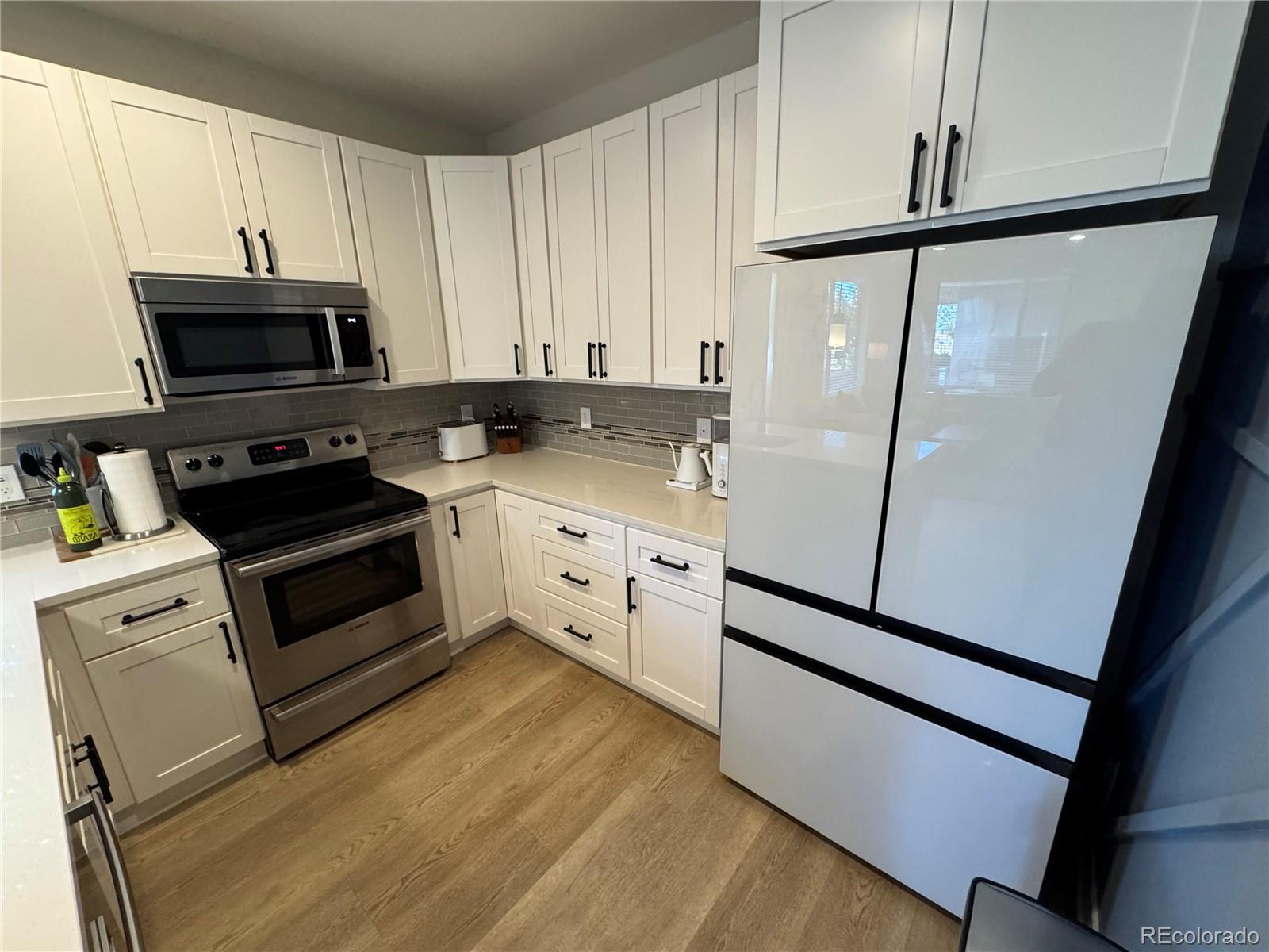 2124 Decatur Street Denver, CO 80211 - Photo 9 of 29 a kitchen with a sink appliances and cabinets