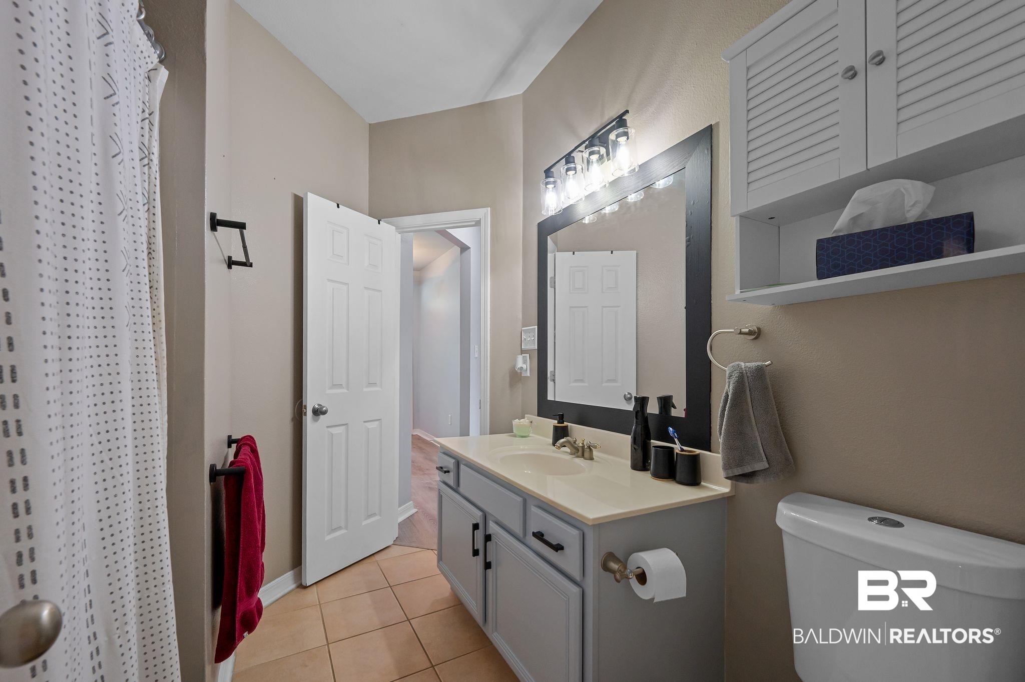 1287 Pembroke Way Foley, AL 36535 - Photo 27 of 39 Full bath featuring vanity, curtained shower, and light tile patterned floors