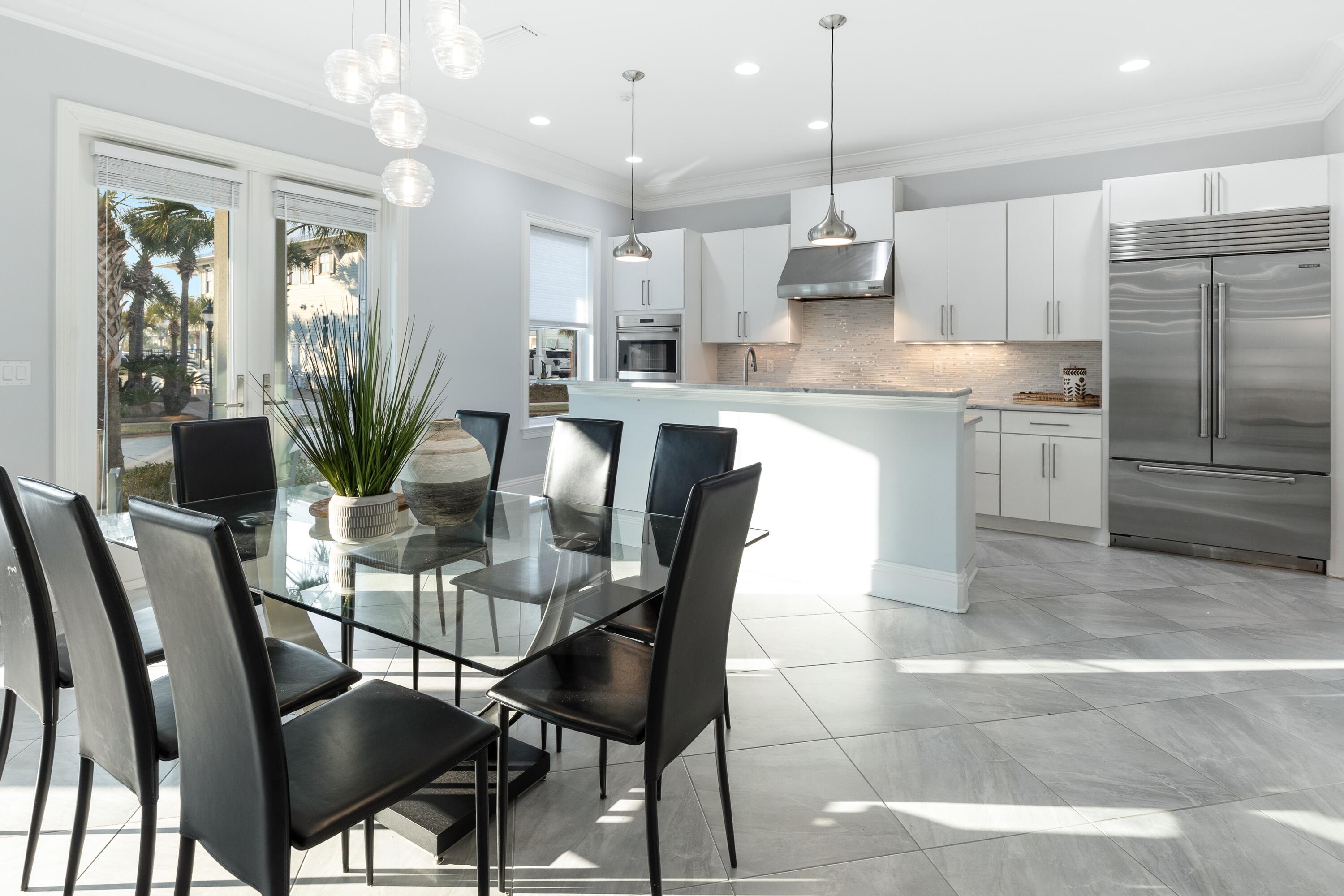 265 Rue Martine Miramar Beach, FL 32550 - Photo 13 of 82 a kitchen with granite countertop stainless steel appliances a table and chairs in it
