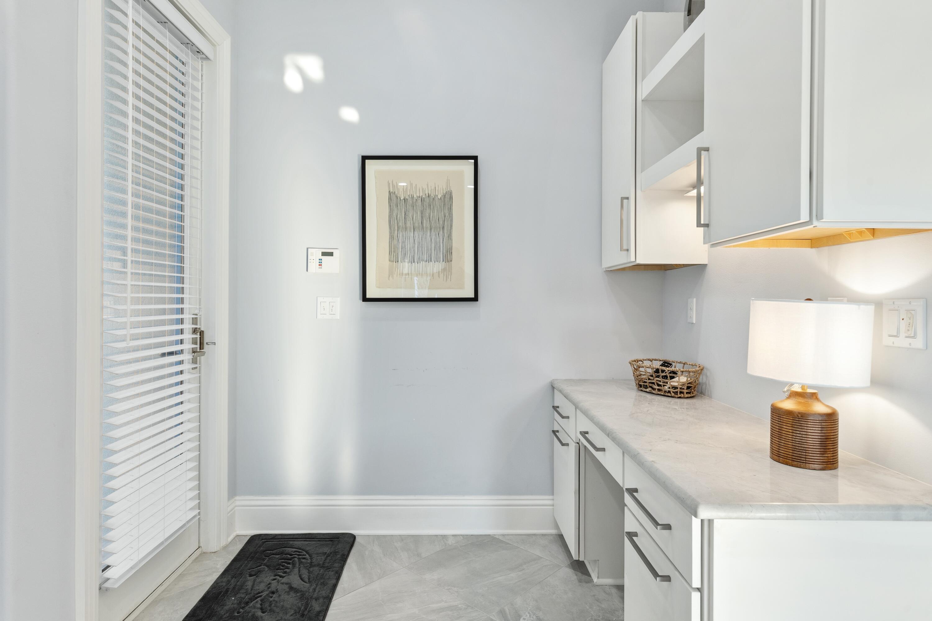 265 Rue Martine Miramar Beach, FL 32550 - Photo 18 of 82 a kitchen with a sink and cabinets