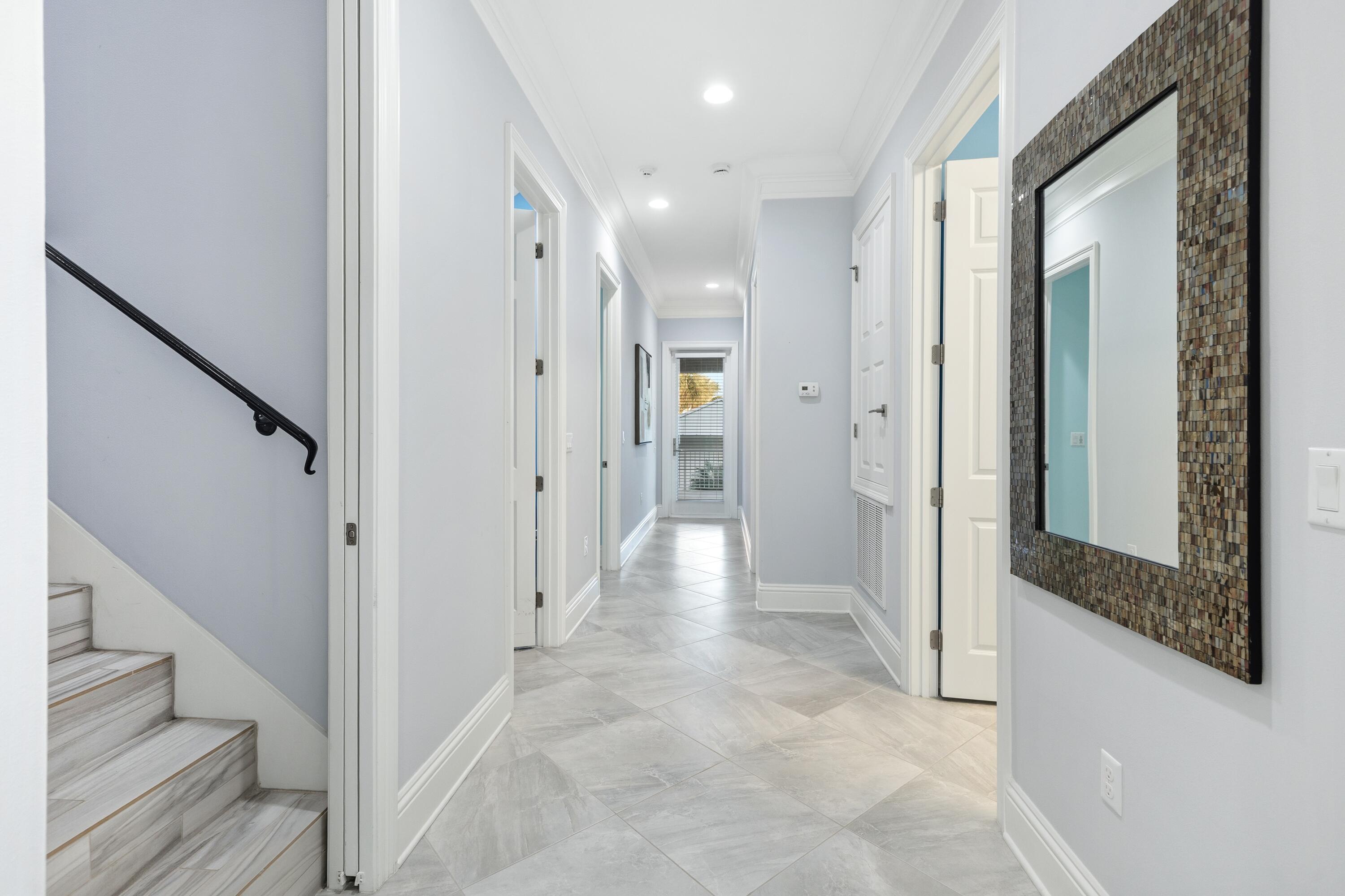 265 Rue Martine Miramar Beach, FL 32550 - Photo 19 of 82 a view of a hallway with wooden floor and staircase