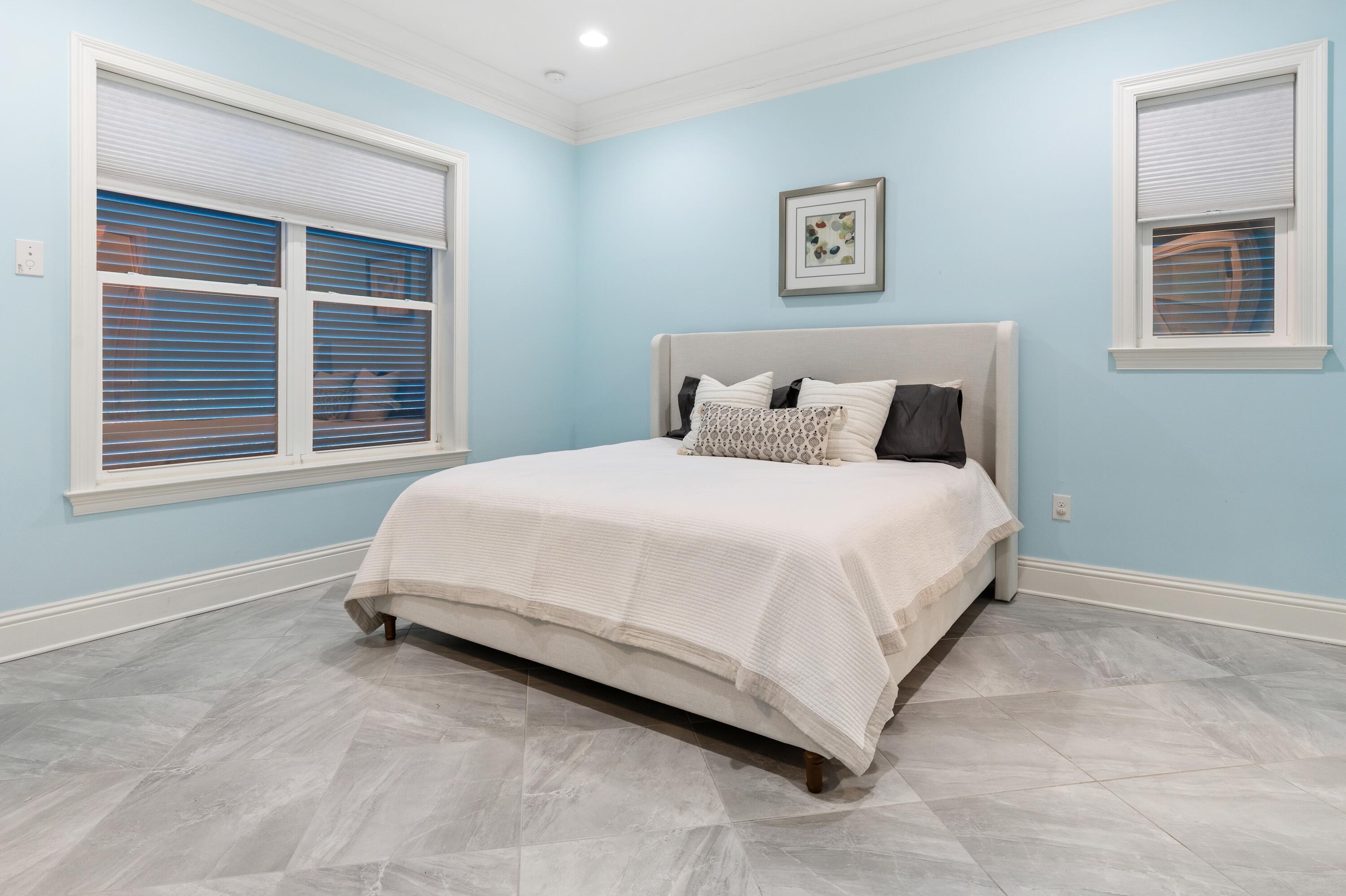 265 Rue Martine Miramar Beach, FL 32550 - Photo 22 of 82 a large bed sitting in a bedroom next to a window