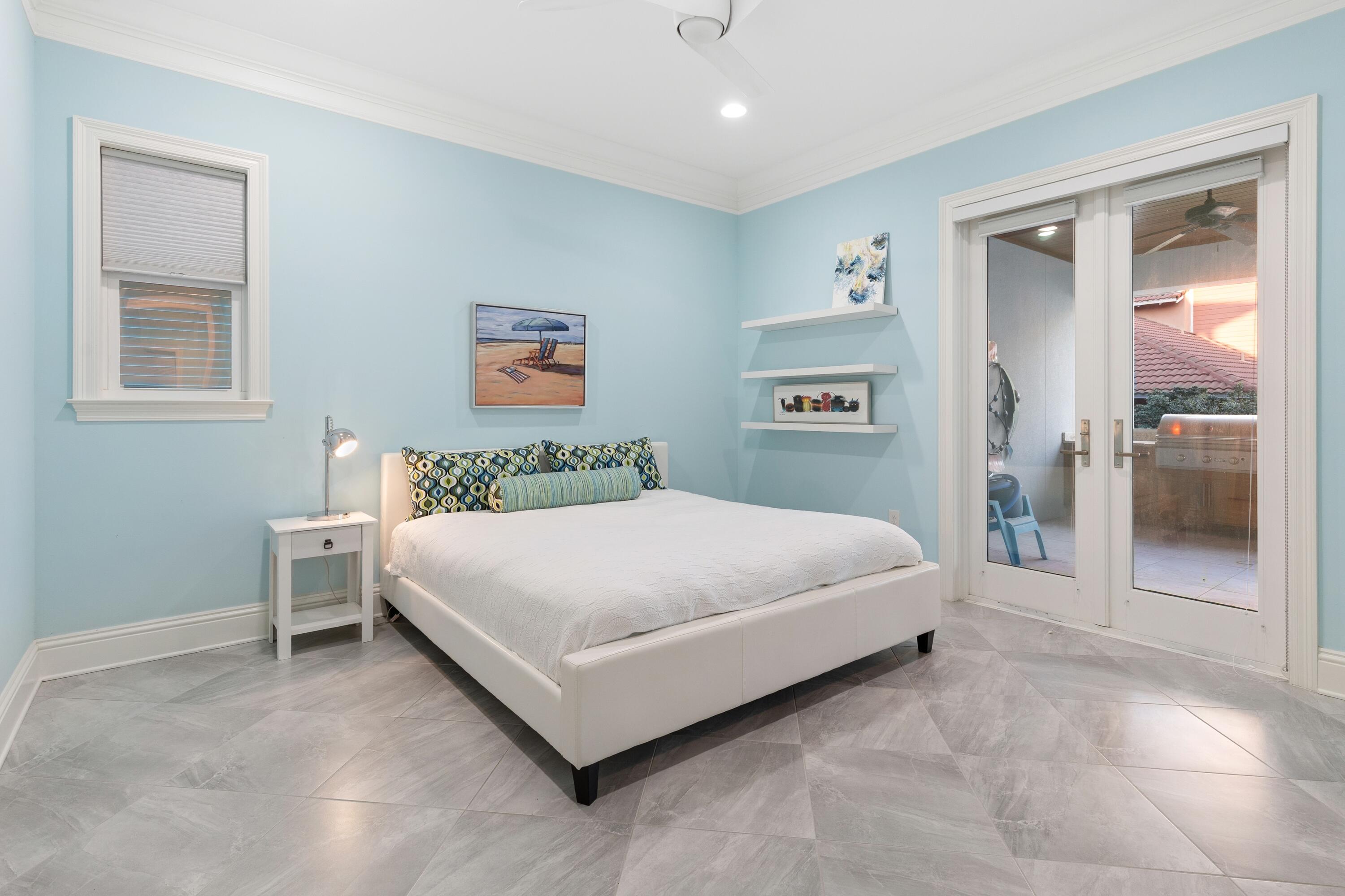 265 Rue Martine Miramar Beach, FL 32550 - Photo 26 of 82 a bedroom with a bed and painting on the wall