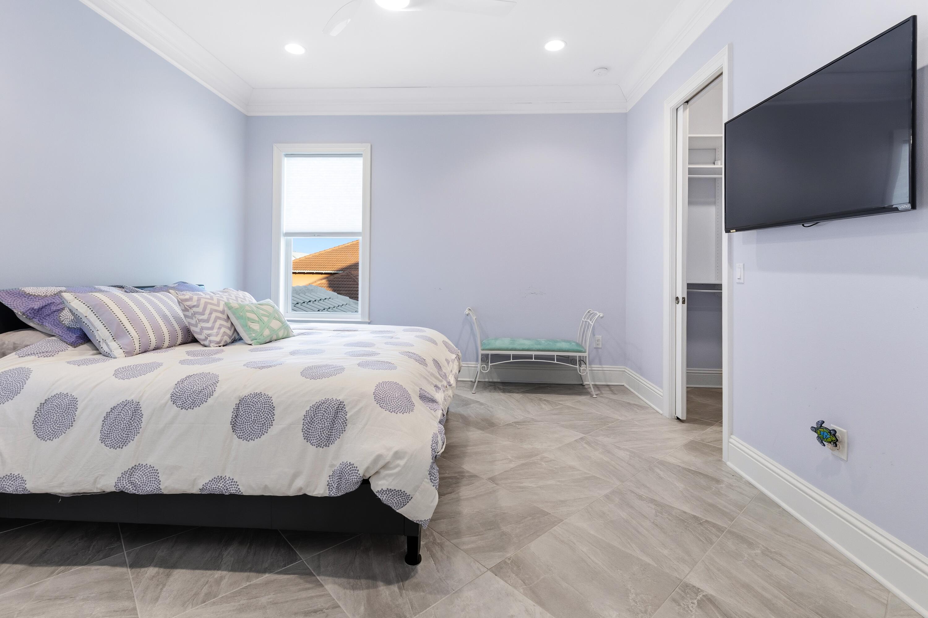 265 Rue Martine Miramar Beach, FL 32550 - Photo 36 of 82 a bedroom with a bed and a flat screen tv