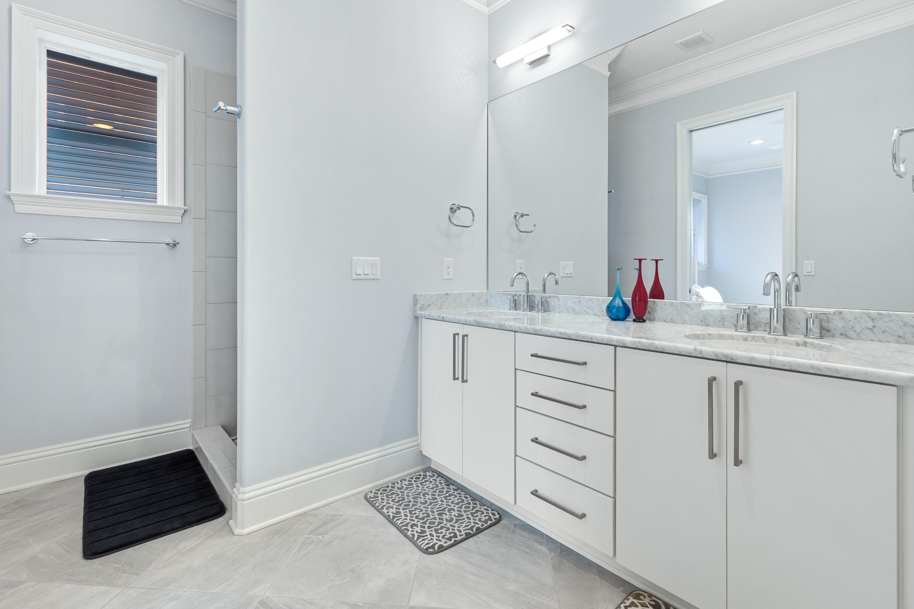 265 Rue Martine Miramar Beach, FL 32550 - Photo 41 of 82 a bathroom with a sink and a mirror