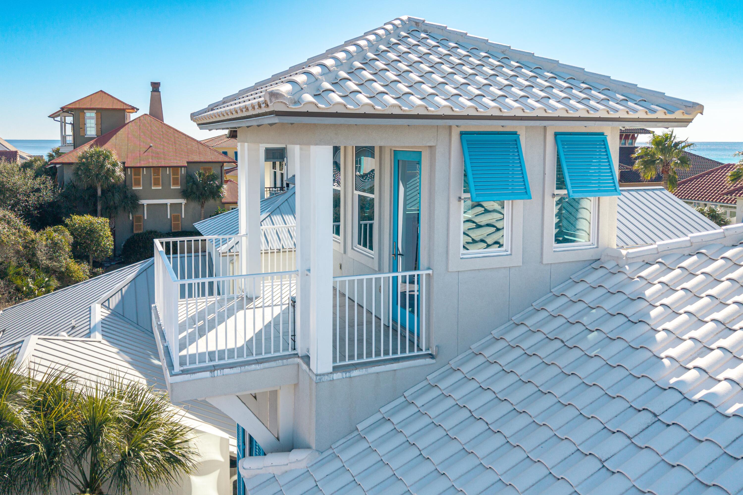 265 Rue Martine Miramar Beach, FL 32550 - Photo 66 of 82 a front view of a house with glass top table and chairs