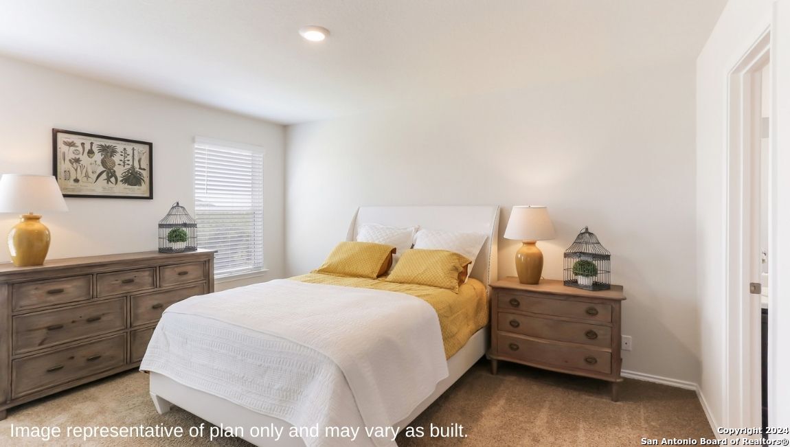 14782 Clay Rdg Run San Antonio, TX 78253 - Photo 13 of 68 a bedroom with a bed and wooden floor