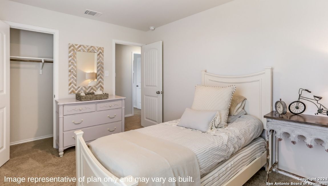 14782 Clay Rdg Run San Antonio, TX 78253 - Photo 21 of 68 a bedroom with a bed and a dresser in it