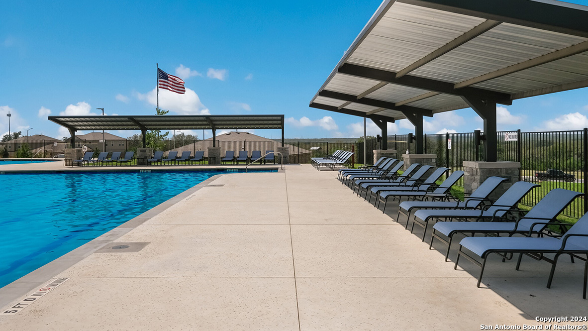 14782 Clay Rdg Run San Antonio, TX 78253 - Photo 41 of 68 a view of a swimming pool with seating area