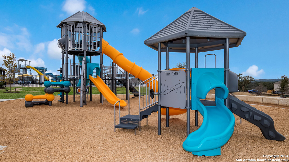 14782 Clay Rdg Run San Antonio, TX 78253 - Photo 46 of 68 a childrens park with lots of swings and slides