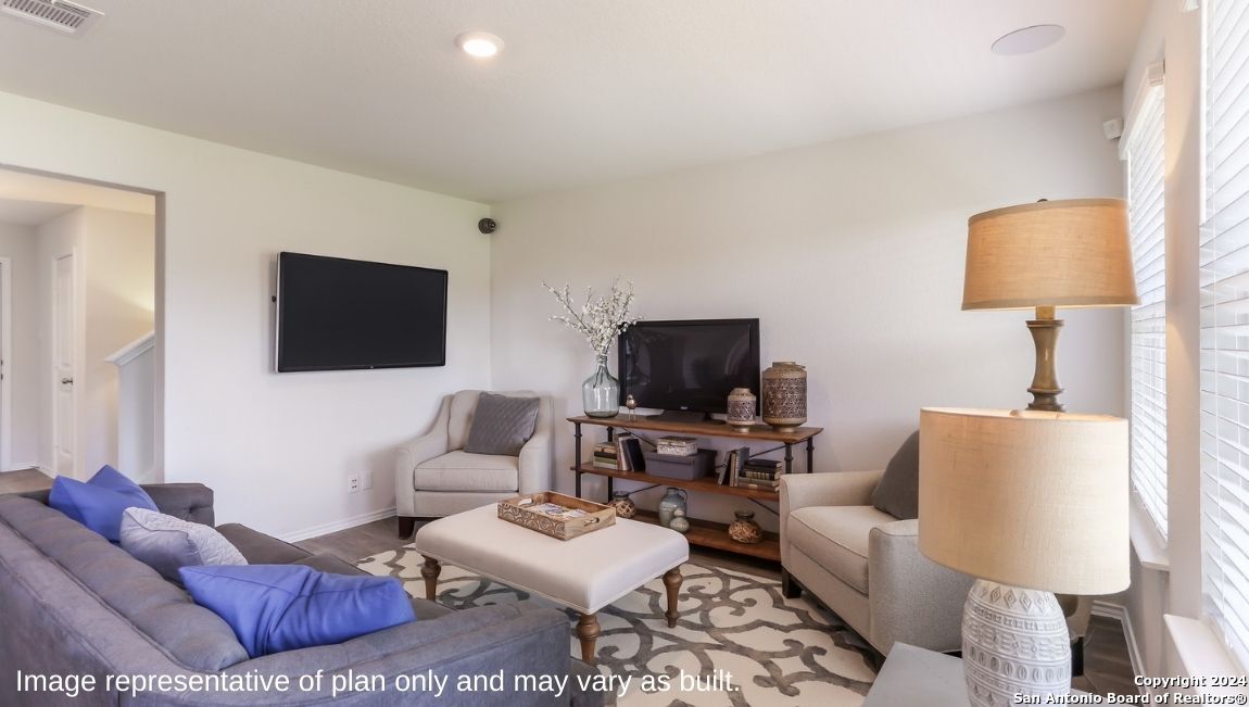 14782 Clay Rdg Run San Antonio, TX 78253 - Photo 5 of 68 a living room with furniture a flat screen tv and a lamp