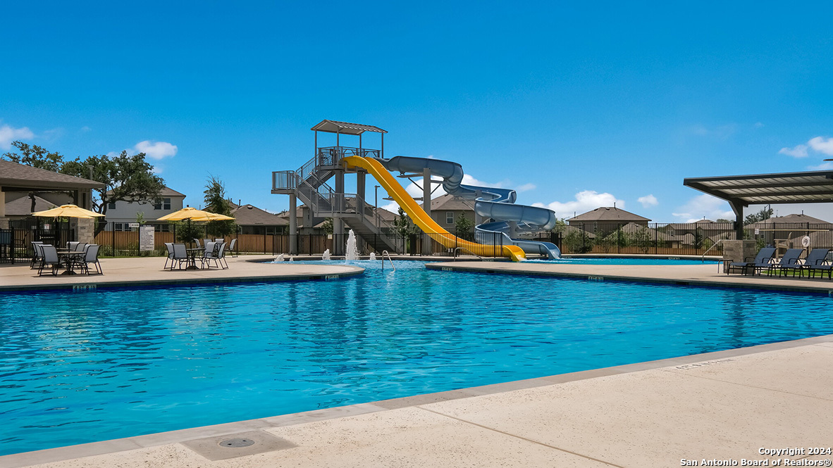 14782 Clay Rdg Run San Antonio, TX 78253 - Photo 55 of 68 a view of a swimming pool with lounge chairs