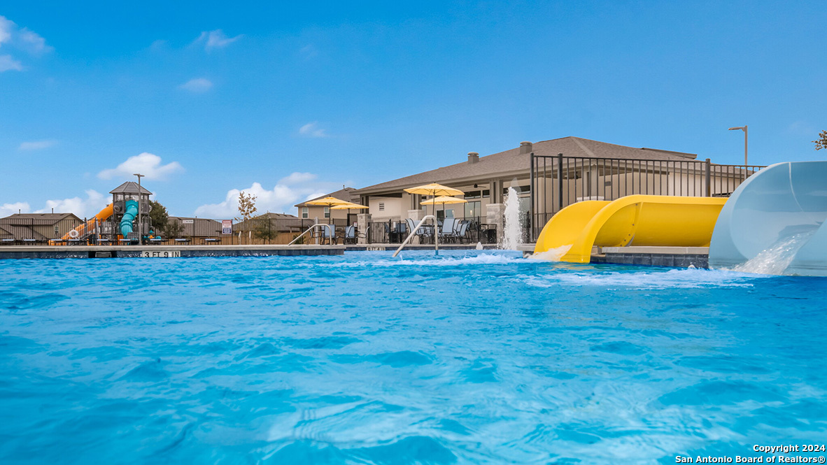 14782 Clay Rdg Run San Antonio, TX 78253 - Photo 61 of 68 a view of a swimming pool with a yard