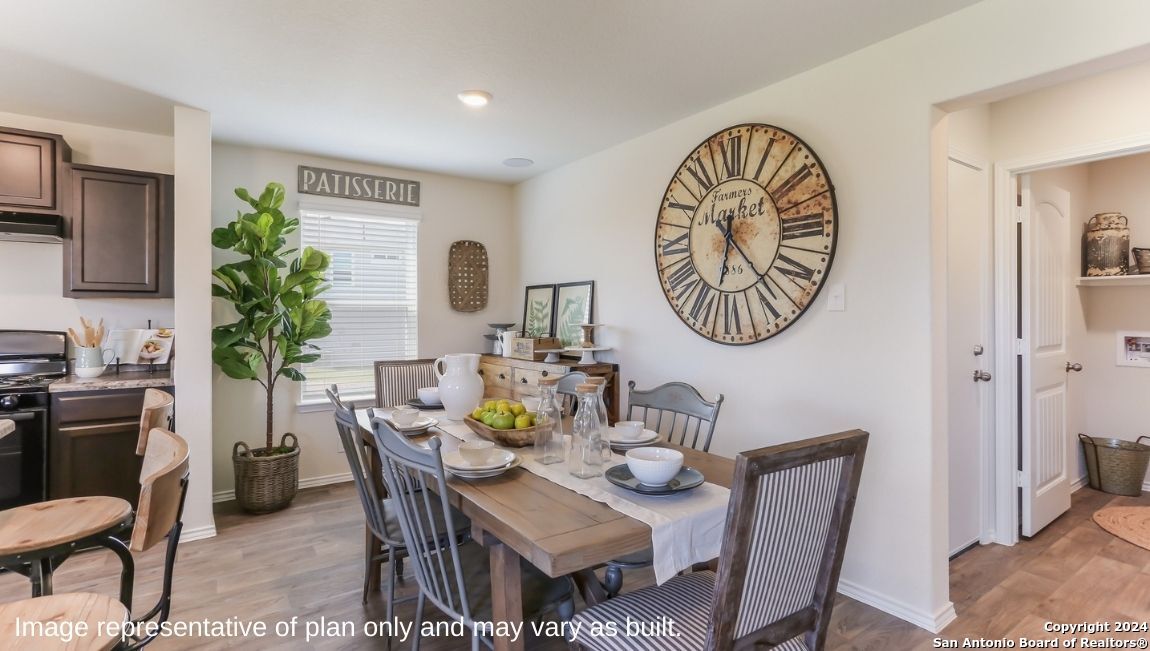 14782 Clay Rdg Run San Antonio, TX 78253 - Photo 10 of 68 a view of a dining room with furniture and wooden floor