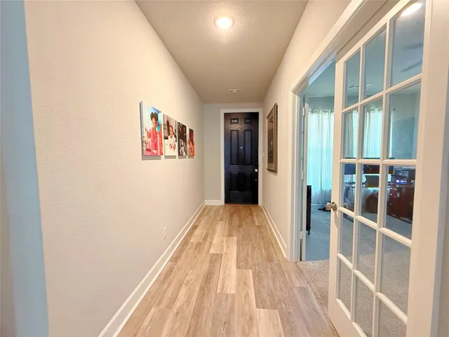 a view of a livingroom with furniture and a flat screen tv