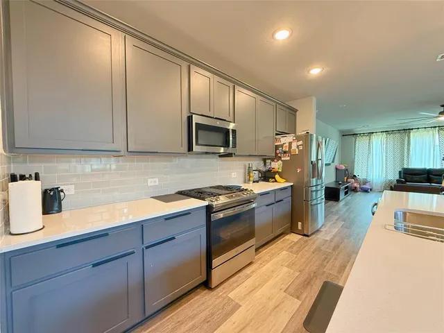 a view of a house with a garden and swimming pool