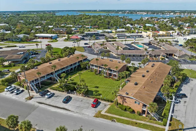 an aerial view of a houses with outdoor space